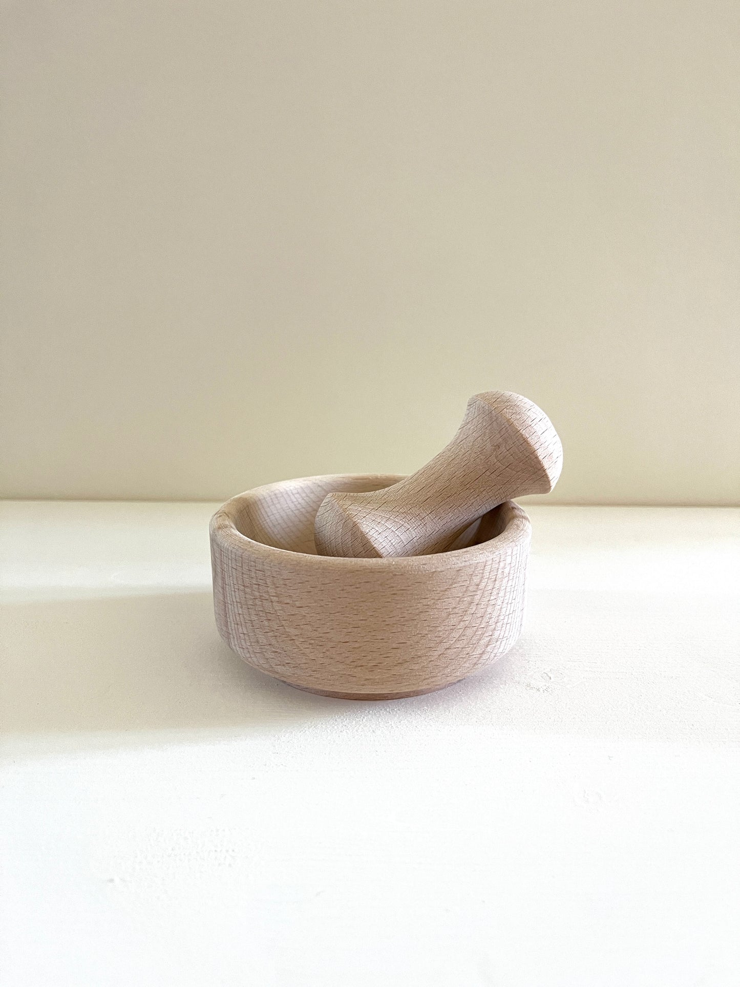 mortar and pestle for grinding spices, made from beech wood